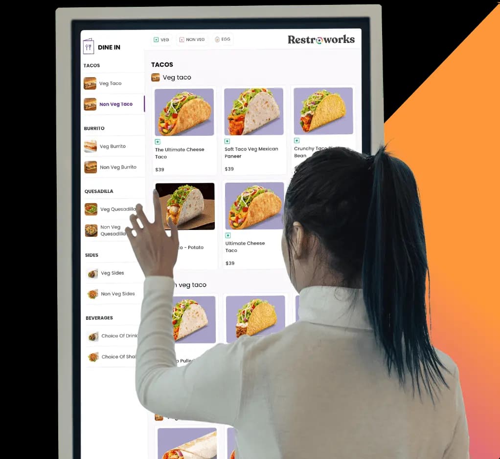 A guest ordering at a Restroworks self-service kiosk